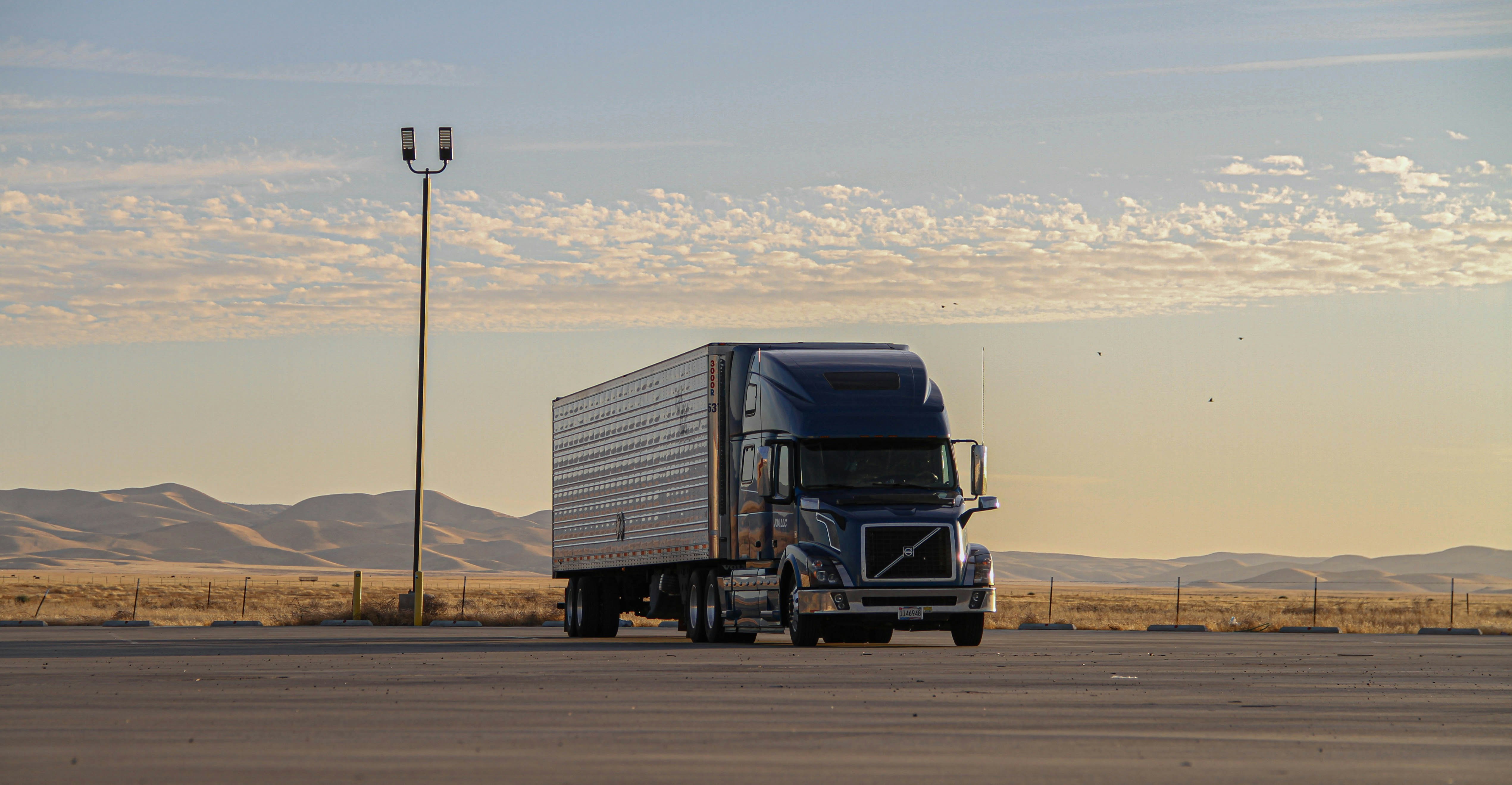 Student driver at the wheel of a tractor-trailer during commercial driving training